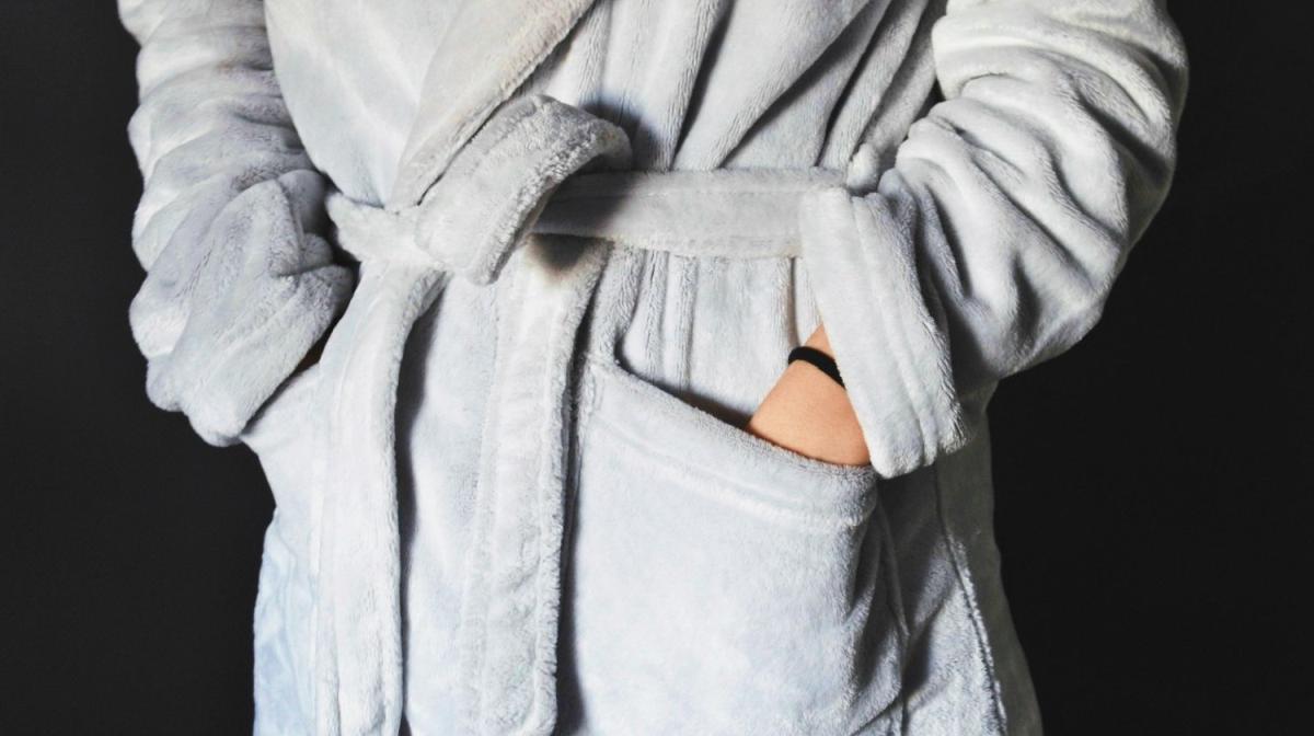 person wearing gray bathrobe | Best Robes For Every Occasion | best robes | best spa robes