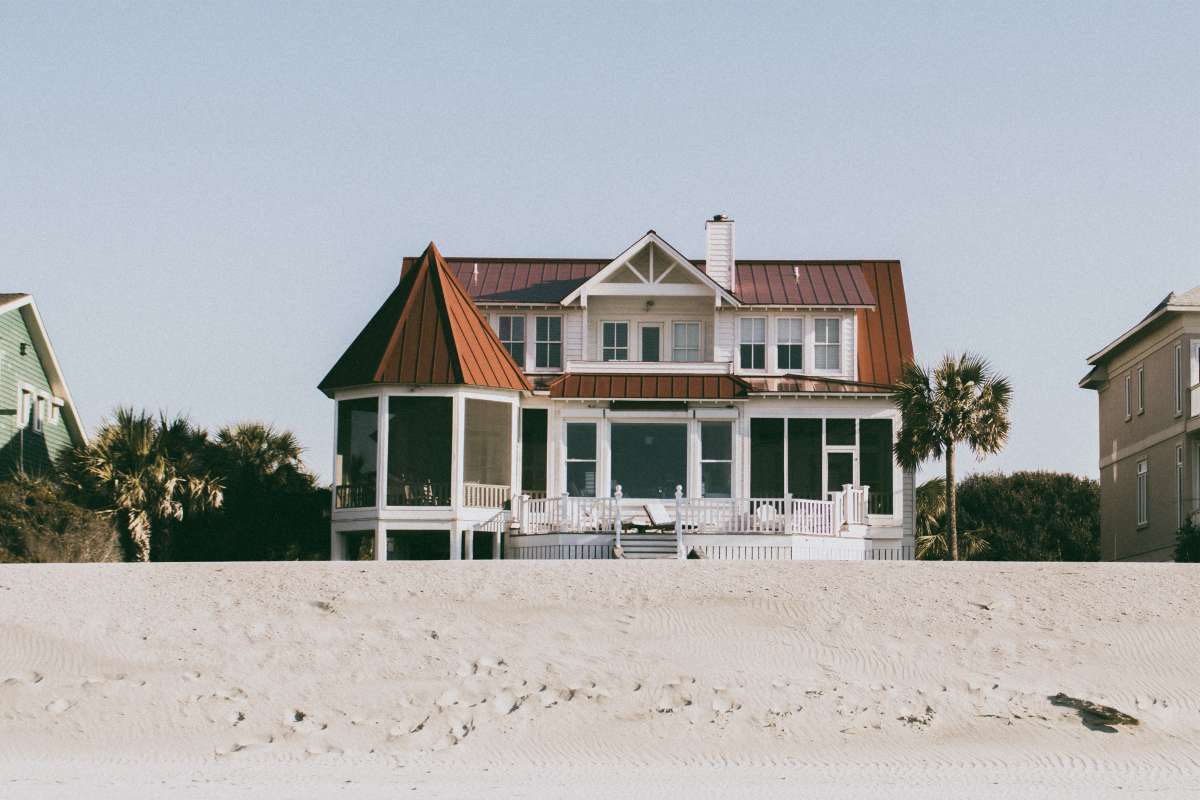 white and brown wooden 2-storey house by the beach | Bachelorette Party Ideas For A Weekend Of Wellness [INFOGRAPHIC] | relaxing bachelorette party ideas | classy bachelorette party ideas