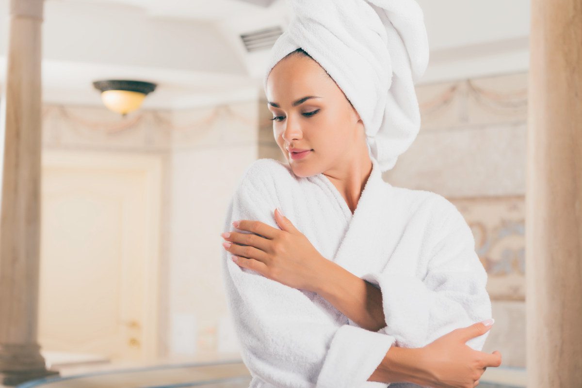 Young woman in white terry robe with towel on head | How To Find The Right Terry Cloth Robe For You