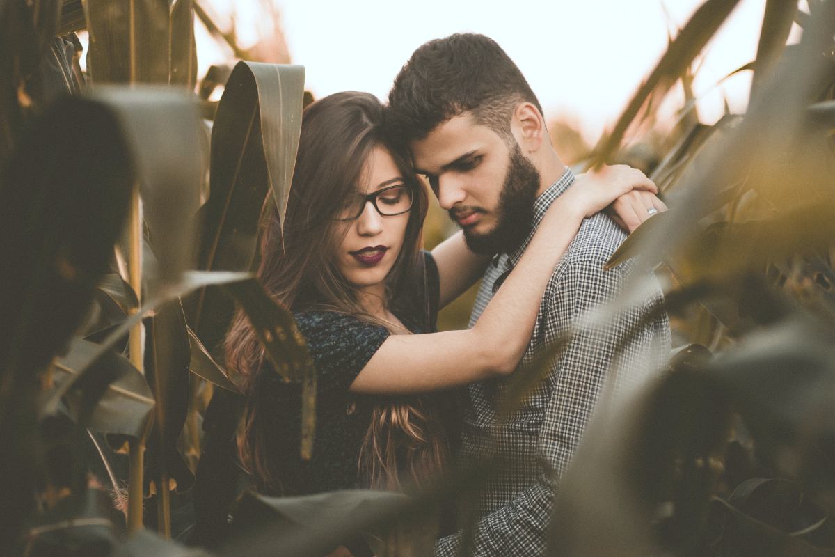 woman hugging man at the corn field | Fun Fall Date Ideas For Any Relationship Stage | fall date ideas | first date ideas