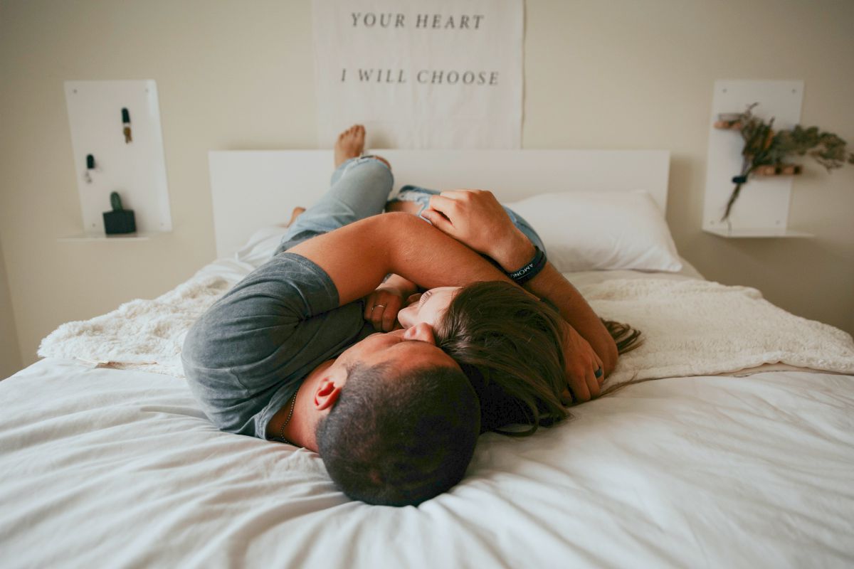 happy couple cuddling in bed | Fun Fall Date Ideas For Any Relationship Stage | fall date ideas | cute fall date ideas