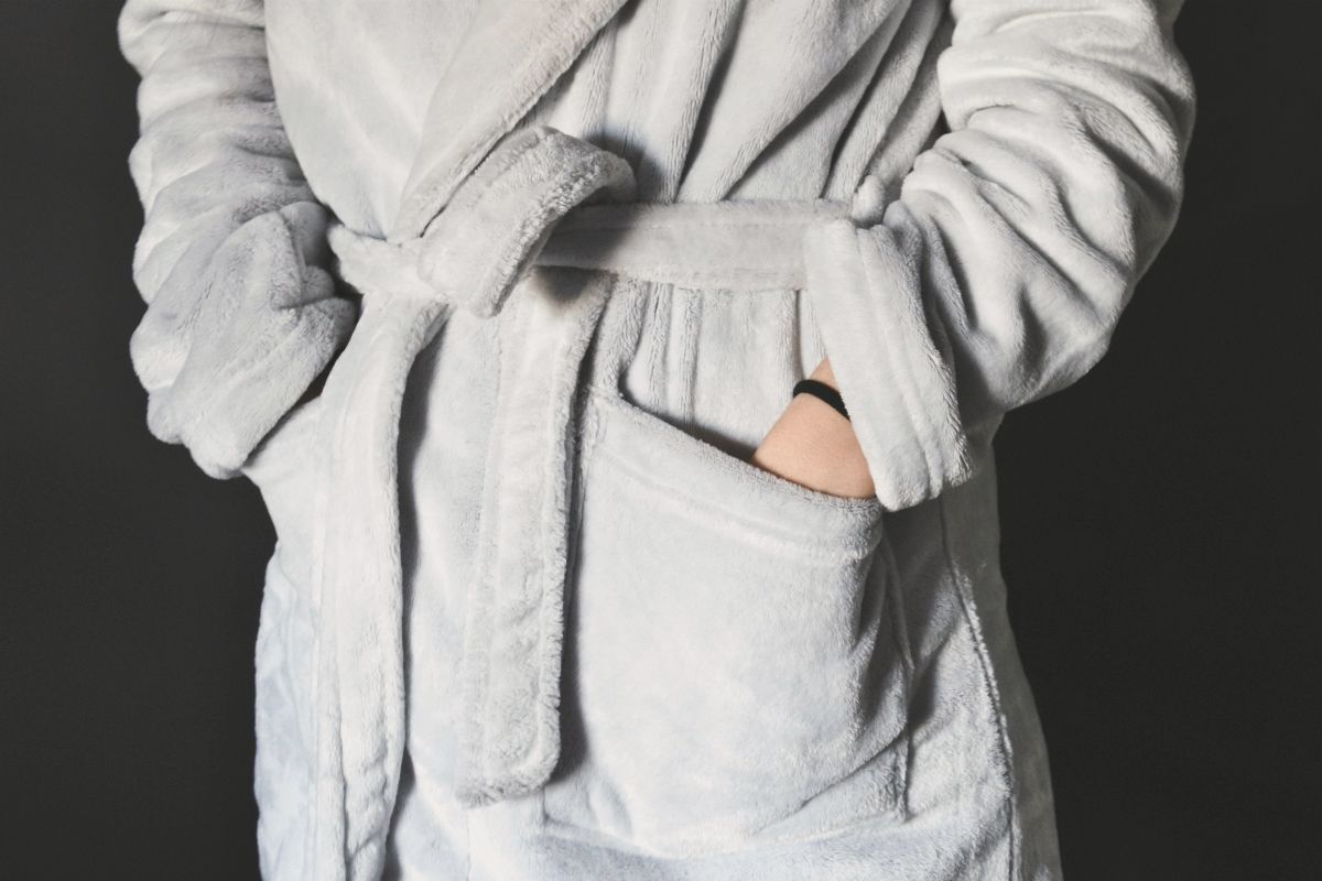 person wearing gray bathrobe | Why Personalized Robes Are A Perfect Gift | personalized robes | personalized bath robes