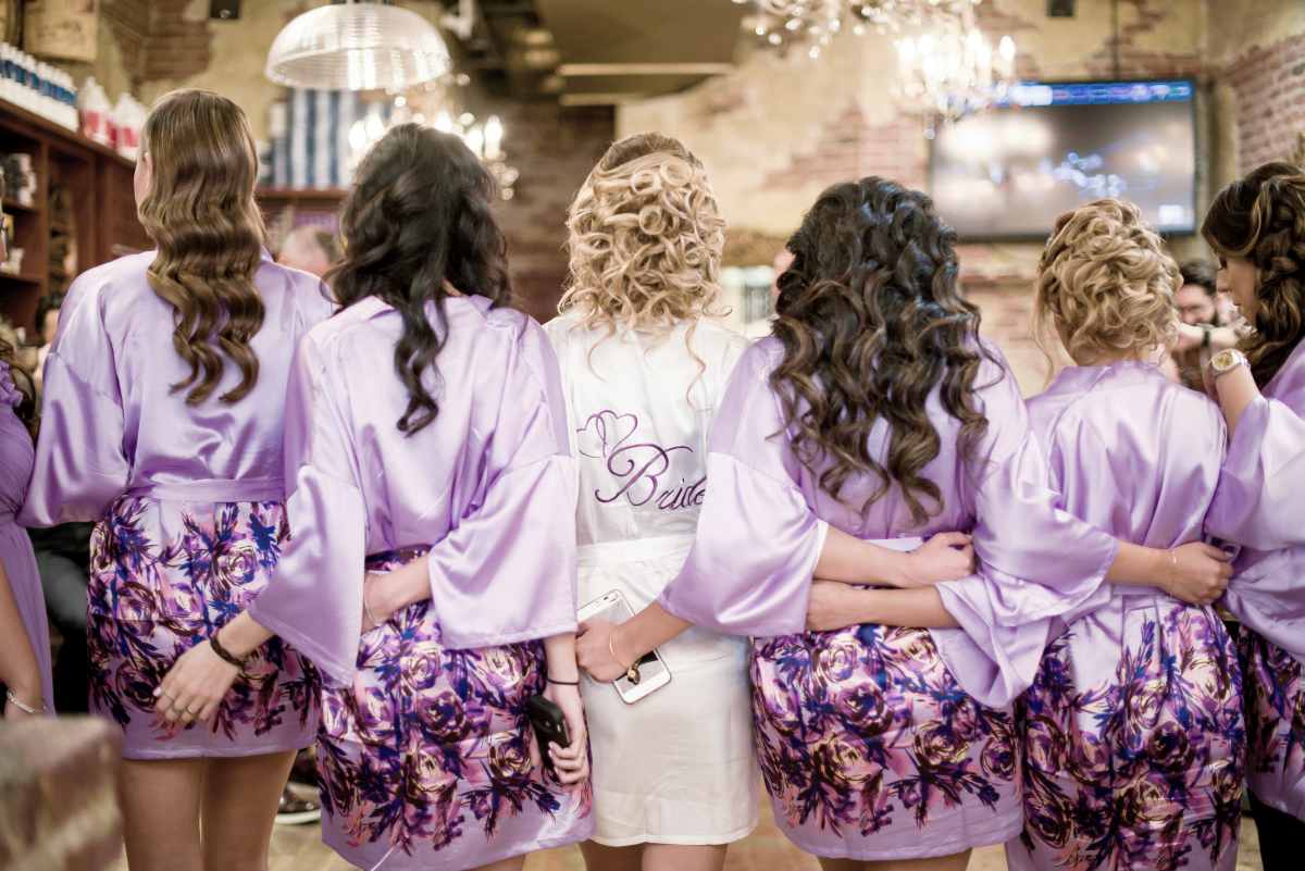 bride and her bridesmaids wearing custom robes | Why Personalized Robes Are A Perfect Gift | personalized robes | personalized bridesmaid robes
