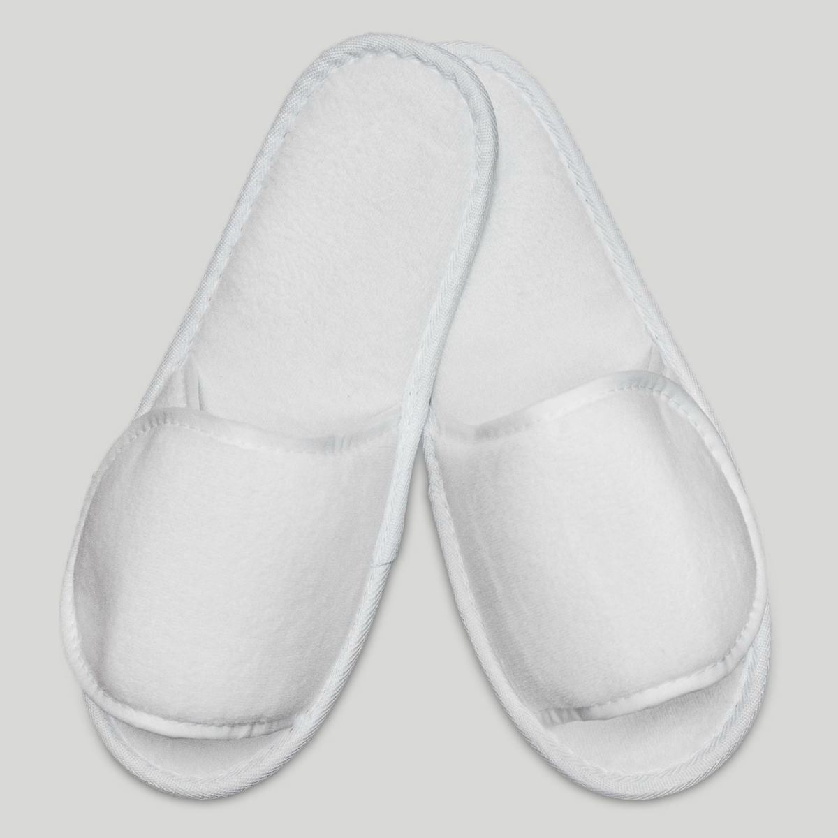 white velcro adjustable slippers | Top Things Every Motel Room Should Have | motel room | motel room items