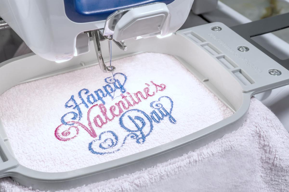 close up picture of workspace embroidery machine | Ways Custom Embroidery Make Your Towel Stand Out | custom embroidery | embroided logo