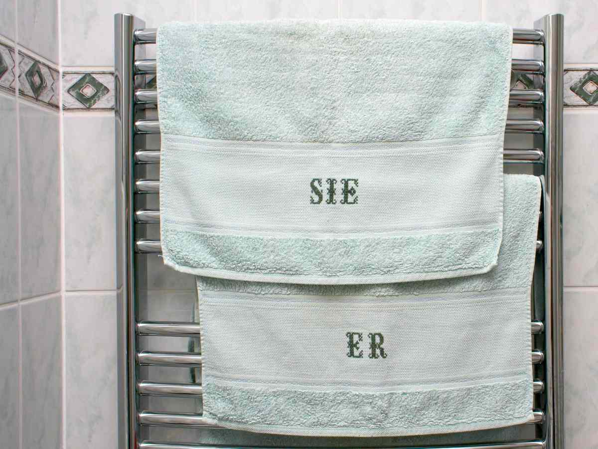 her and him embroidered towels in the bathroom | Ways Custom Embroidery Make Your Towel Stand Out | custom embroidery | custom embroidery online