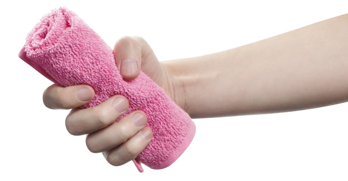 person gripping hand towel | How To Choose The Right Wholesale Towels For Your Business | wholesale towels | wholesale bath towels