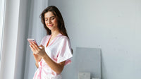 beautiful young woman wearing robe standing
